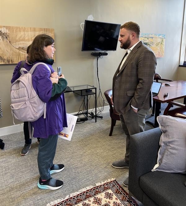 Consumer speaking with Senator