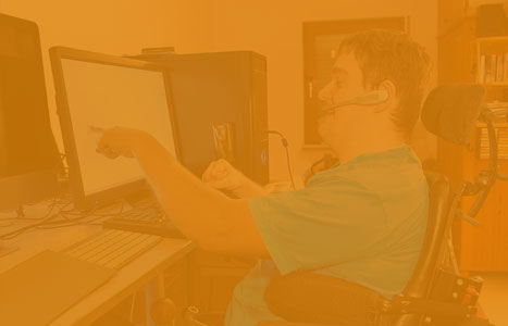 boy pointing at a computer screen
